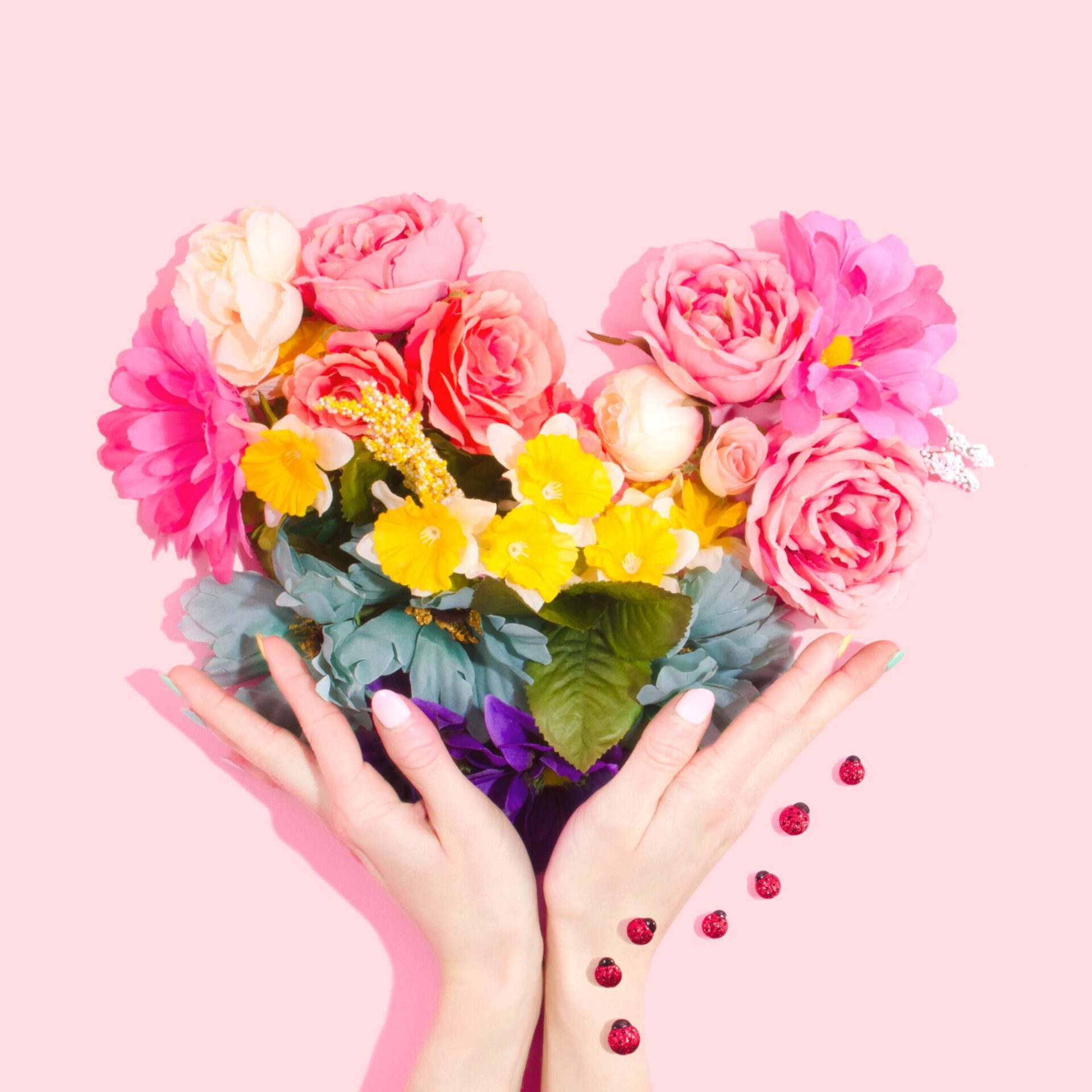 hands holding floral heart
