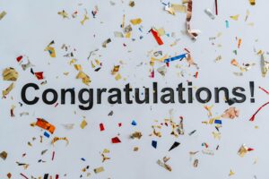 congratulations text overlay with confetti