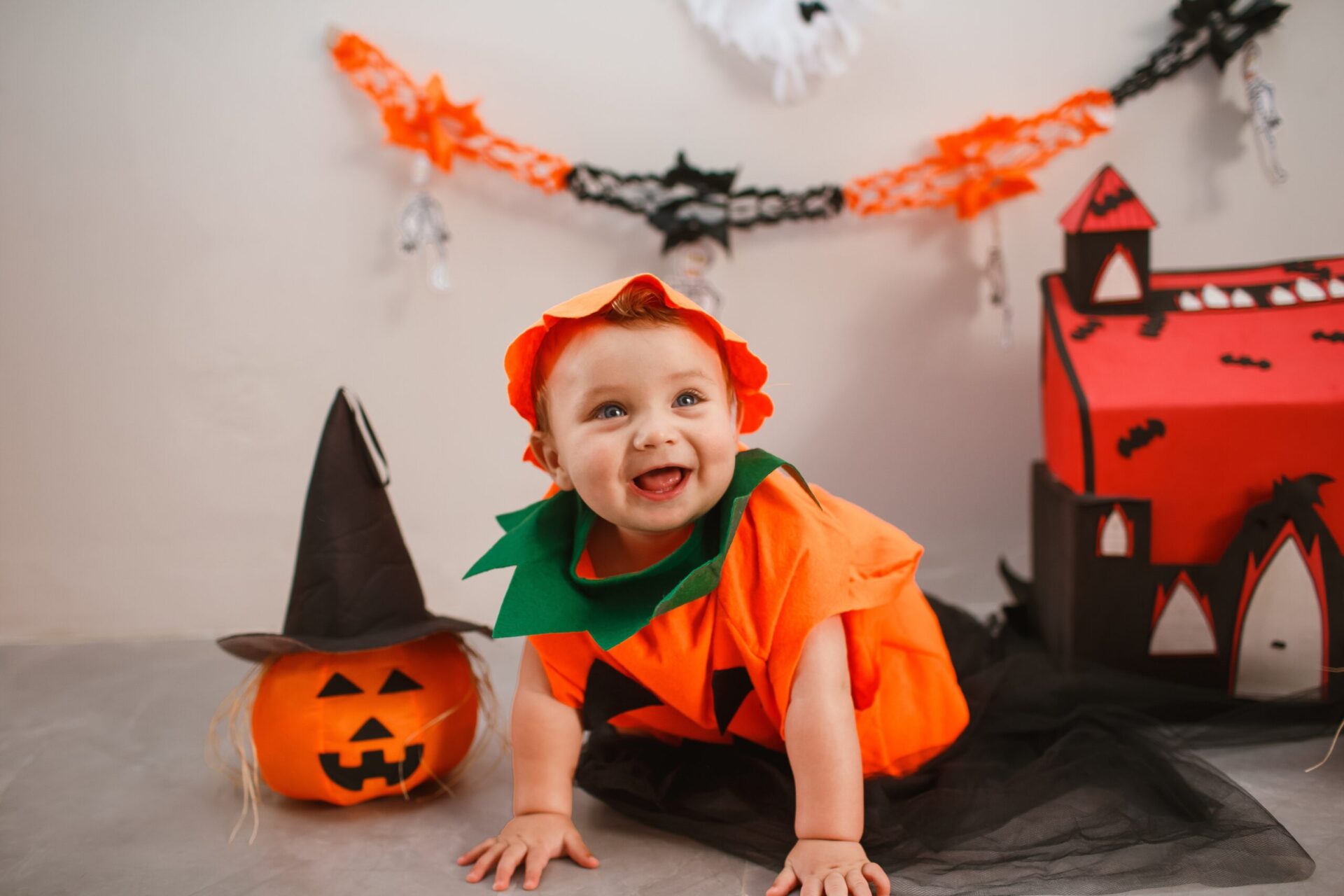 Halloween baby dressed as pumpkin