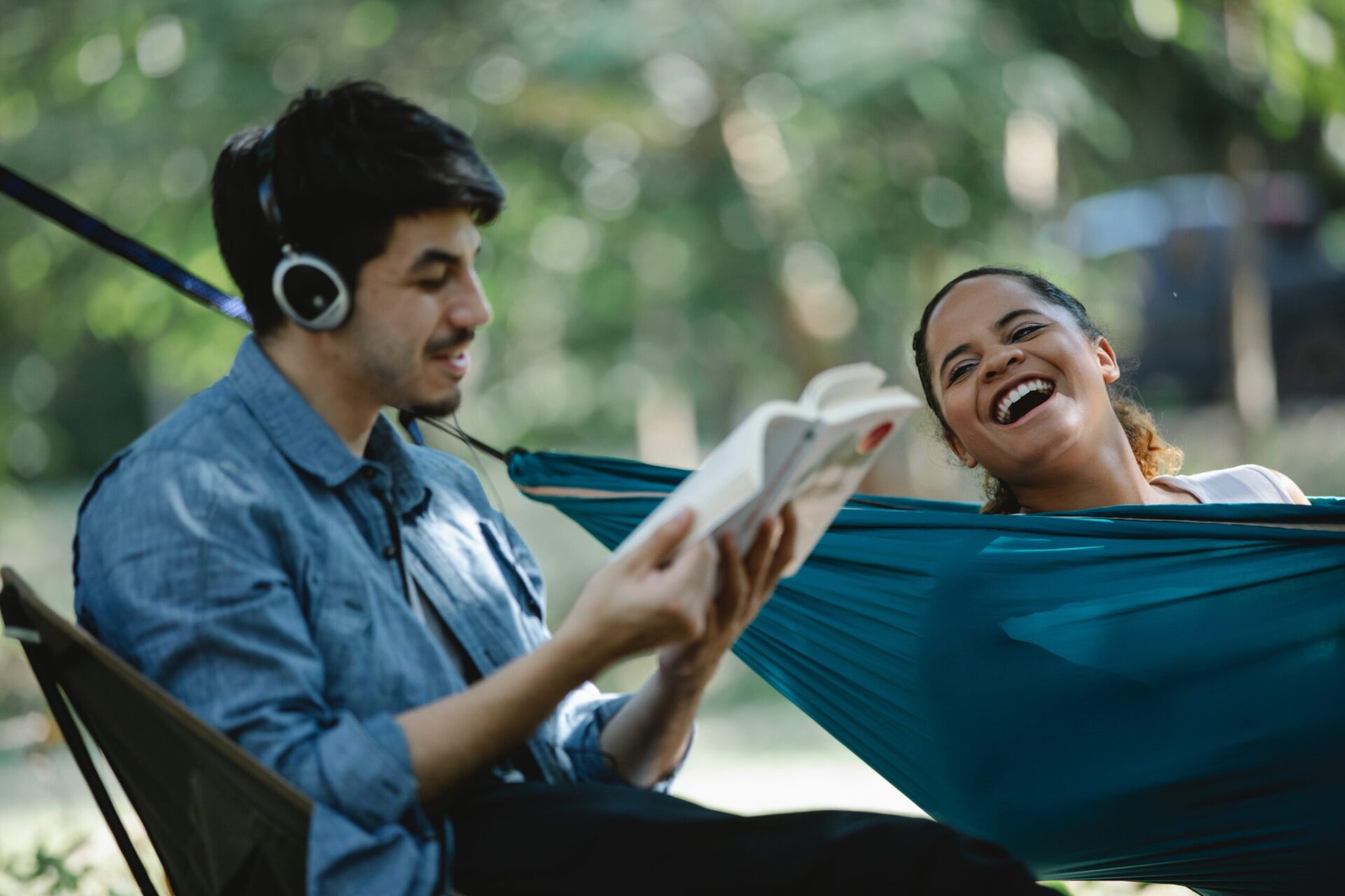 couple laughing at book